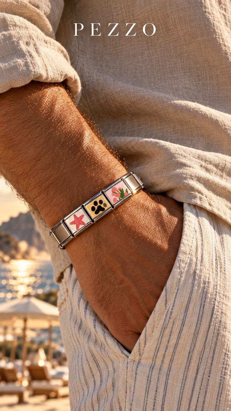 Hand in pocket wearing a PEZZO charm bracelet at golden hour