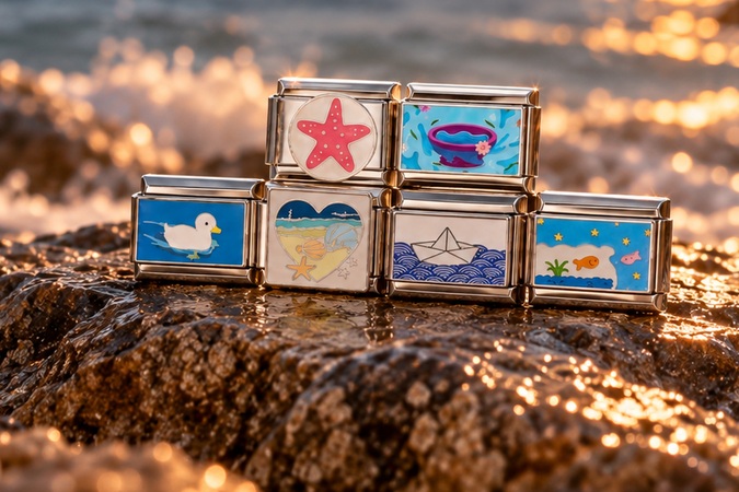 All six Ocean charm links together on coastal rock